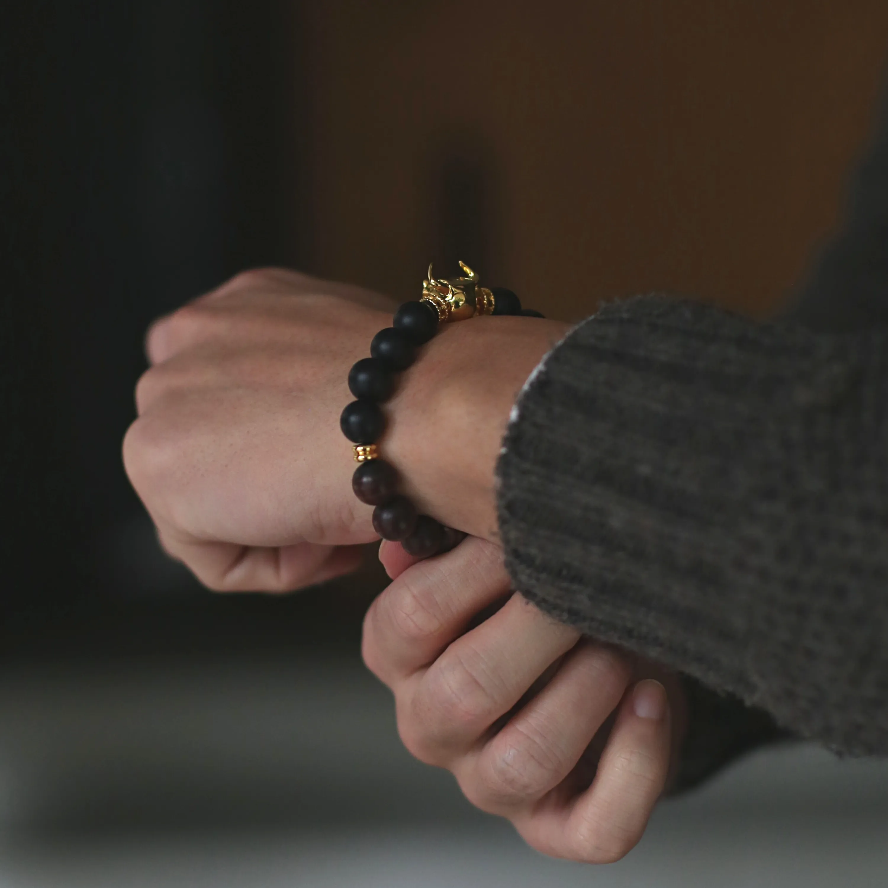 Gold Bull, Matt obsidian bracelet with gold beads