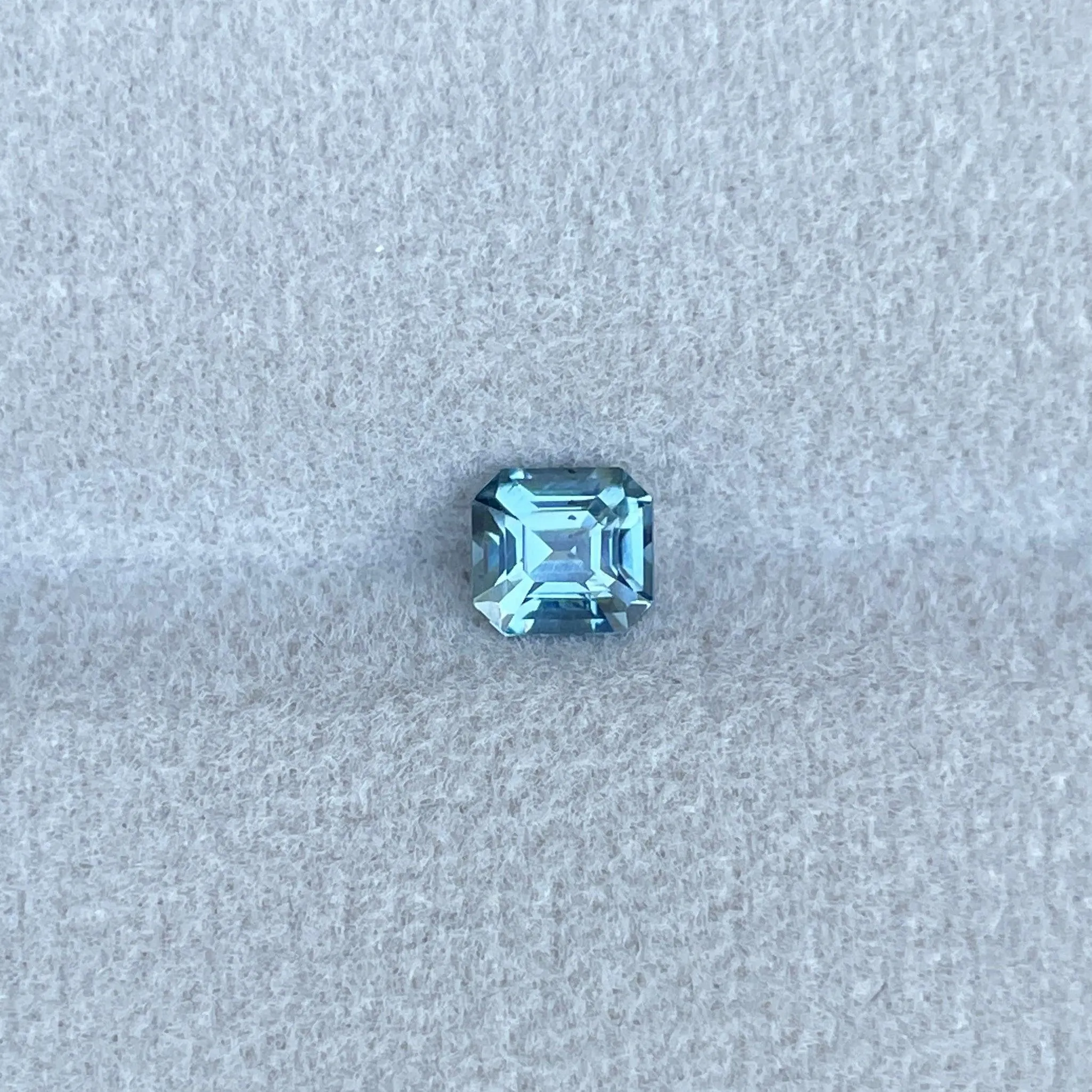 Teal sapphire | natural, bluish green, Emerald cut, VVS, 0.78ct, Madagascar