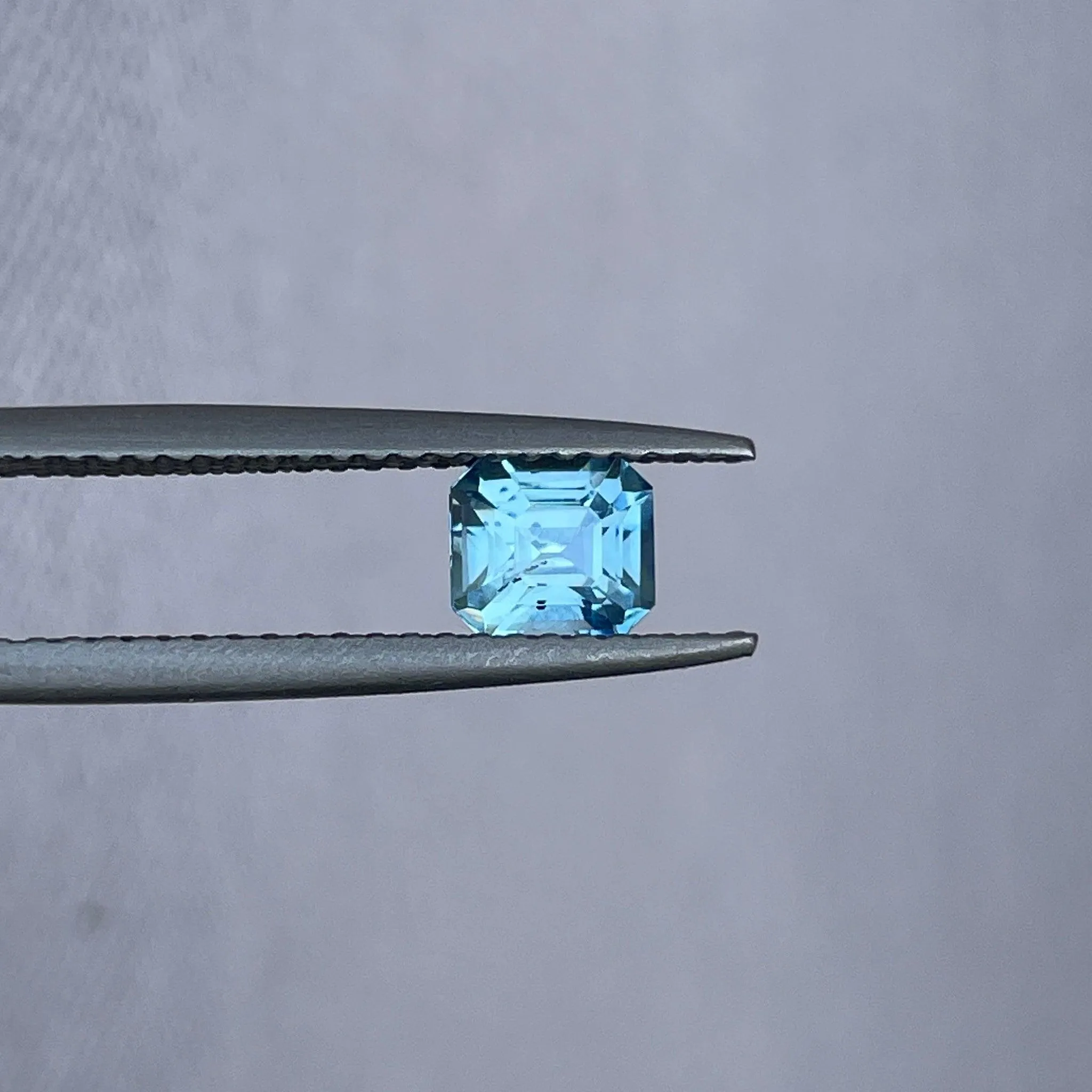 Teal sapphire | natural, bluish green, Emerald cut, VVS, 0.78ct, Madagascar