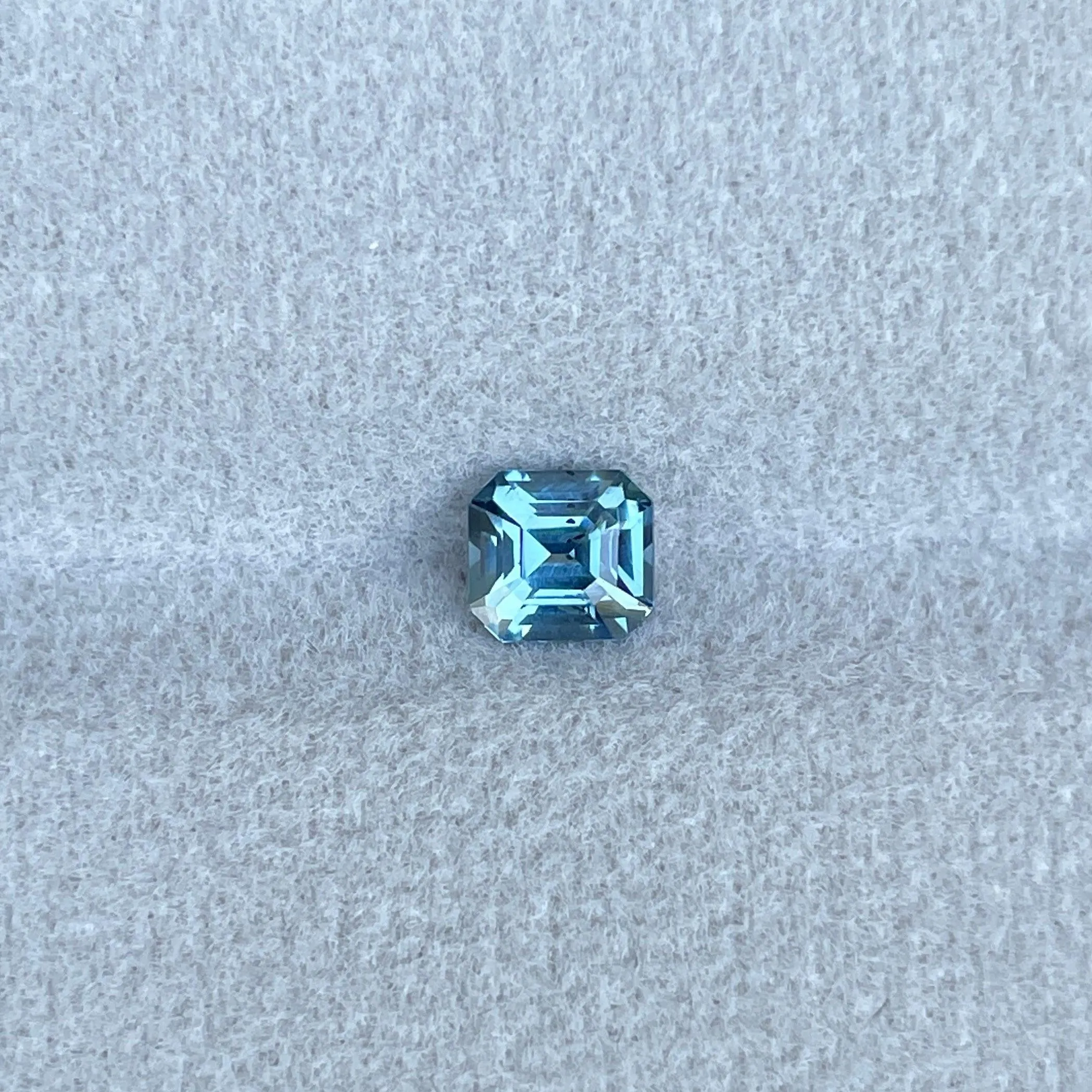 Teal sapphire | natural, bluish green, Emerald cut, VVS, 0.78ct, Madagascar
