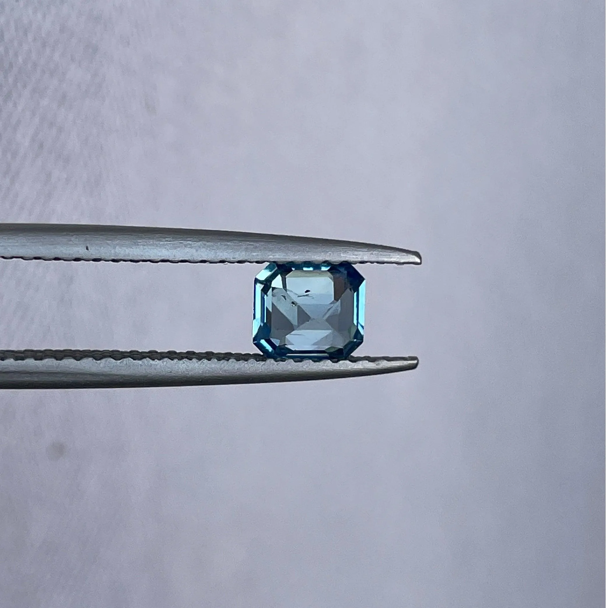 Teal sapphire | natural, bluish green, Emerald cut, VVS, 0.78ct, Madagascar